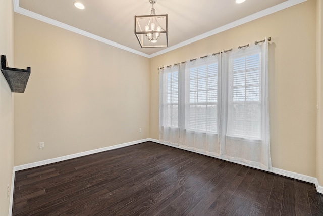 unfurnished room featuring crown molding, dark hardwood / wood-style floors, and an inviting chandelier