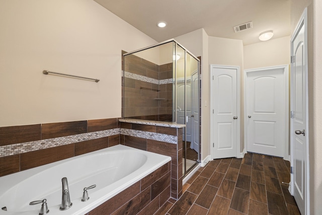 bathroom featuring plus walk in shower