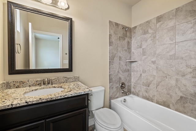 full bathroom with tiled shower / bath combo, vanity, and toilet