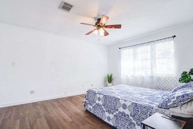 bedroom featuring hardwood / wood-style flooring and ceiling fan