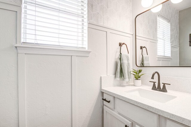 bathroom with vanity and a wealth of natural light