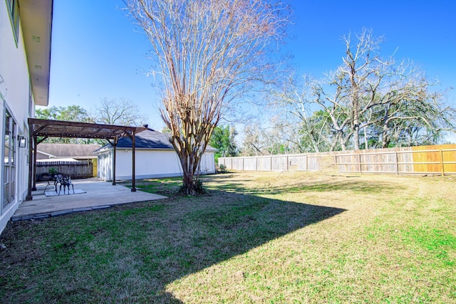 view of yard featuring a patio area, a fenced backyard, and a pergola