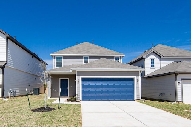 traditional-style house with a front yard, a garage, driveway, and roof with shingles