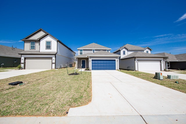 traditional-style home featuring a front yard and concrete driveway