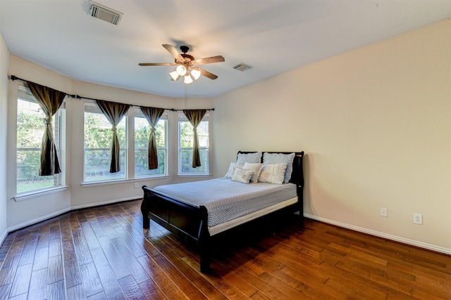 bedroom featuring dark wood-type flooring and ceiling fan