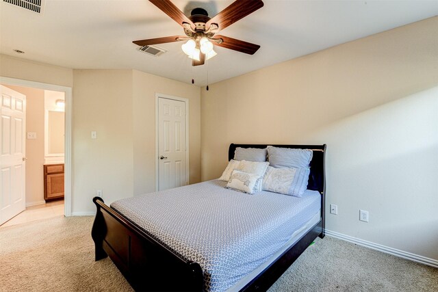 bedroom featuring light carpet and ceiling fan