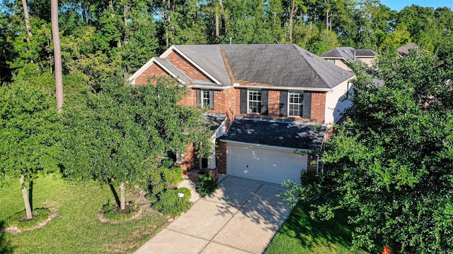 view of front property featuring a garage and a front yard