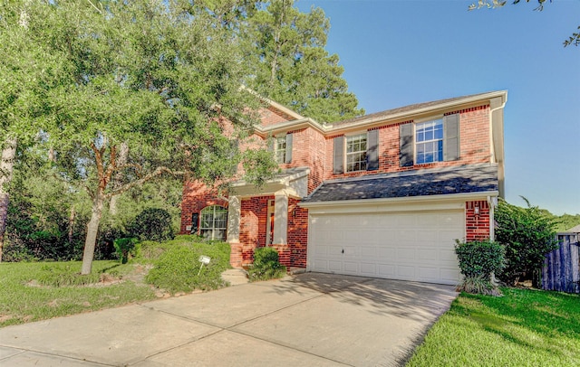 view of front facade with a garage and a front yard