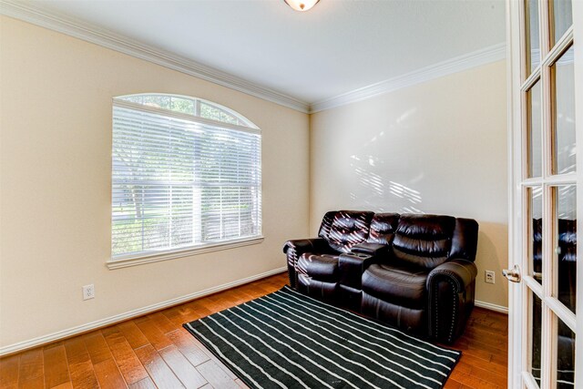 living room featuring crown molding and wood-type flooring