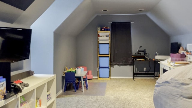 carpeted bedroom with lofted ceiling