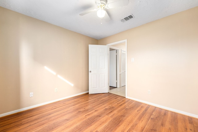 1727 Oakwell Ln, Katy, TX 77449 - unfurnished room featuring baseboards, light wood-type flooring, and ceiling fan