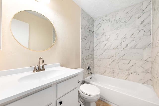 full bathroom with tiled shower / bath, vanity, a textured ceiling, and toilet