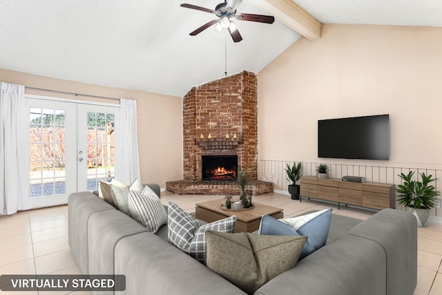 living room with a brick fireplace, vaulted ceiling with beams, light tile patterned floors, and french doors