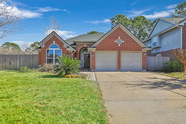 view of property with a garage and a front yard