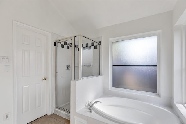 bathroom featuring independent shower and bath and tile patterned flooring