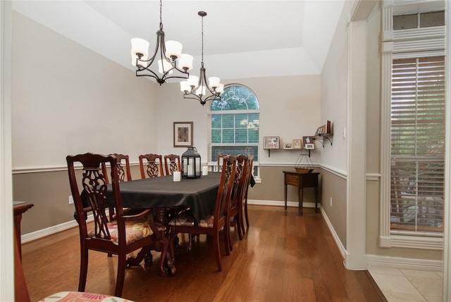 dining room featuring hardwood / wood-style floors and a notable chandelier