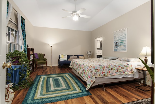 bedroom featuring lofted ceiling, dark hardwood / wood-style floors, and ceiling fan