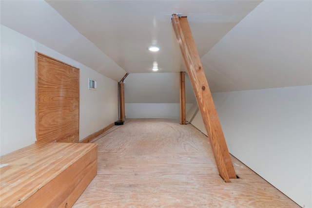 bonus room featuring visible vents and vaulted ceiling