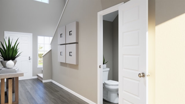 hall with dark hardwood / wood-style flooring