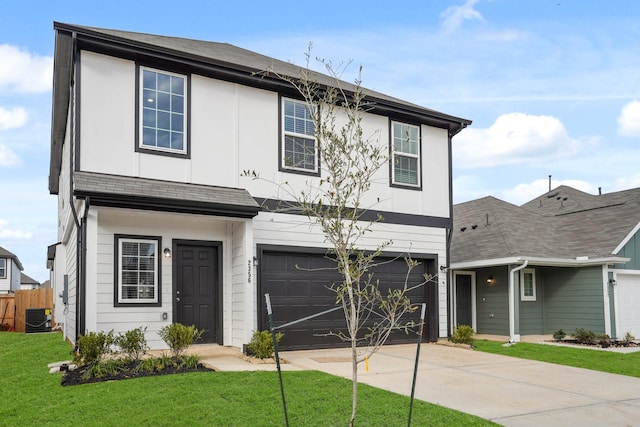 traditional-style home with driveway, an attached garage, central AC unit, and a front lawn