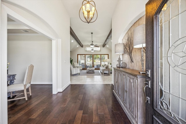 entryway featuring dark hardwood / wood-style flooring, ceiling fan with notable chandelier, and lofted ceiling with beams