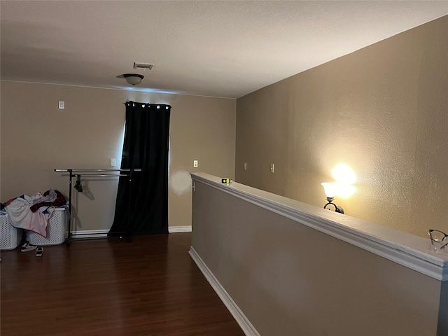 hall with dark hardwood / wood-style floors