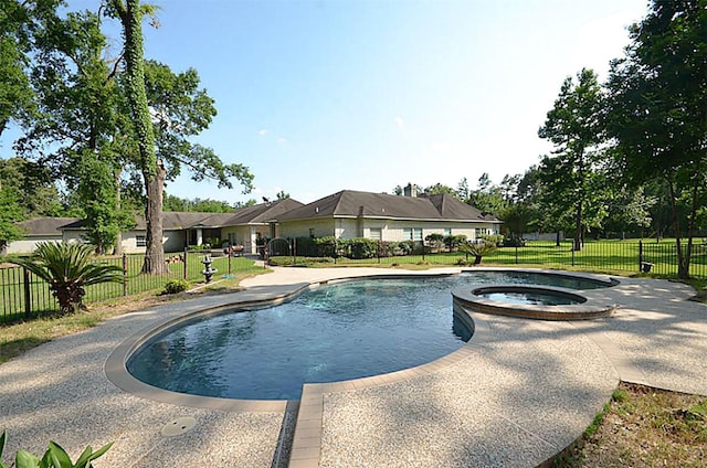 view of pool featuring an in ground hot tub, a yard, and a patio area