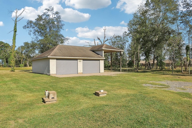 garage featuring a yard