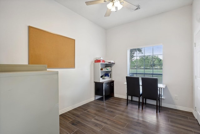 home office with dark wood-type flooring and ceiling fan