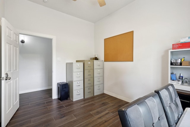 home office with dark hardwood / wood-style floors and ceiling fan