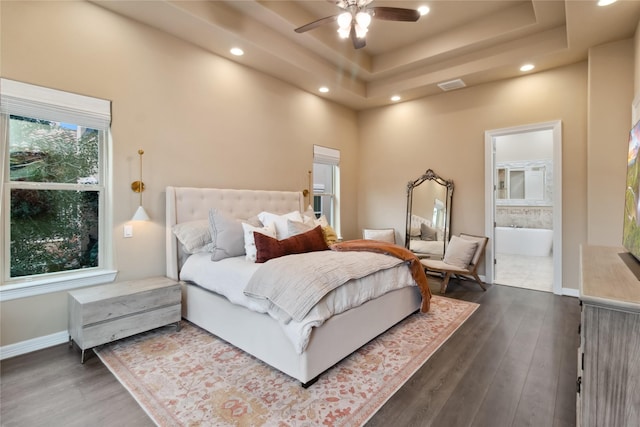 bedroom featuring baseboards, visible vents, recessed lighting, dark wood-type flooring, and a raised ceiling