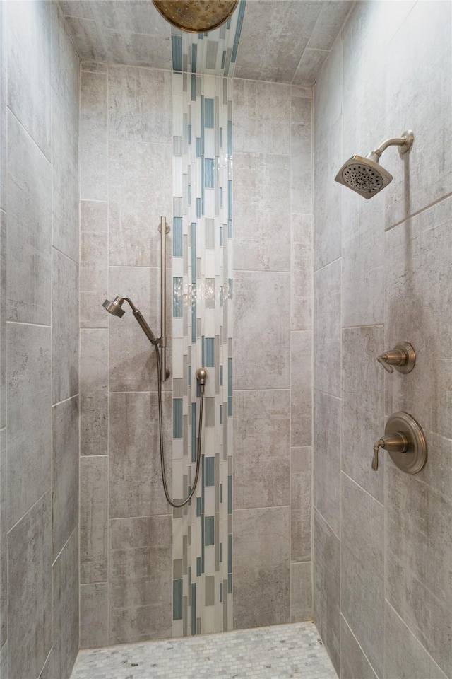 bathroom with tiled shower