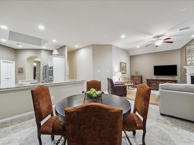 dining area with lofted ceiling and ceiling fan