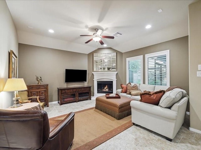 living room with vaulted ceiling and ceiling fan