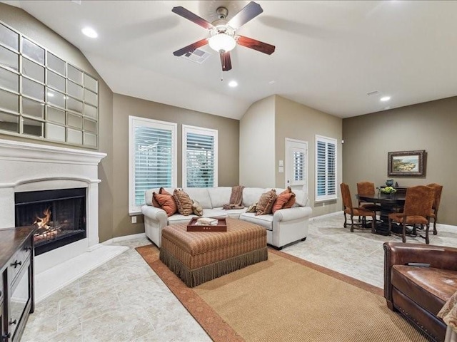 carpeted living room featuring ceiling fan