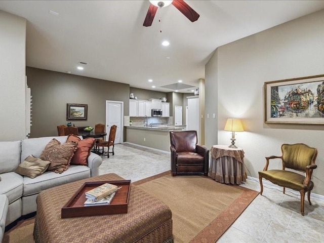 living room with ceiling fan