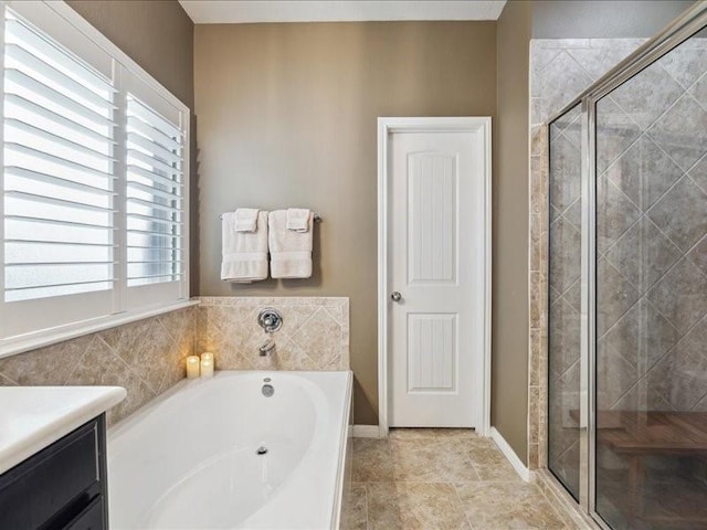 bathroom with tile patterned flooring, vanity, and plus walk in shower