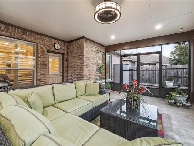 living room with brick wall