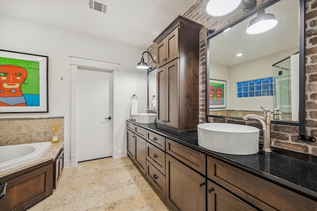 bathroom featuring vanity and a bath