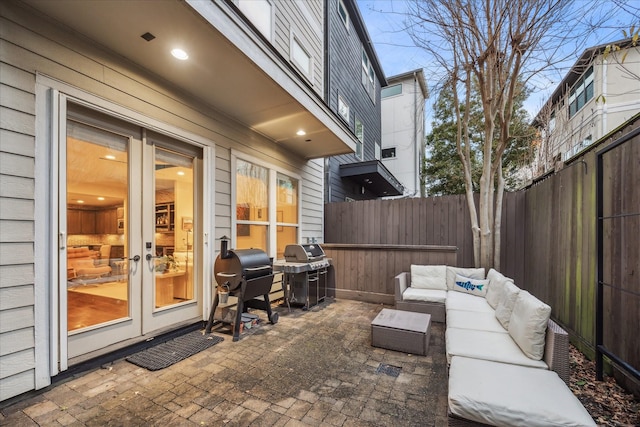 view of patio / terrace with french doors, grilling area, and outdoor lounge area