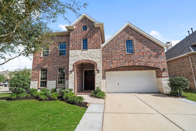 view of front of home featuring a garage and a front lawn