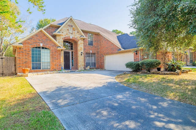 view of front facade with a garage and a front lawn