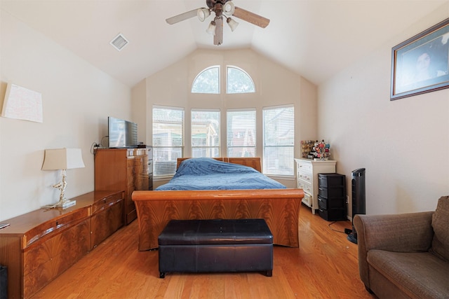 bedroom with vaulted ceiling, ceiling fan, and light hardwood / wood-style flooring