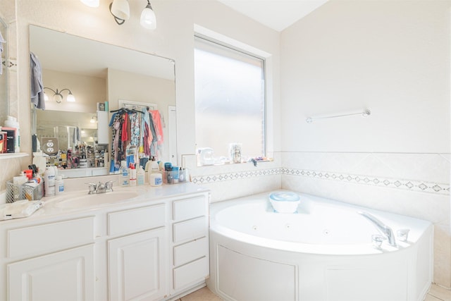 bathroom featuring vanity and a bath