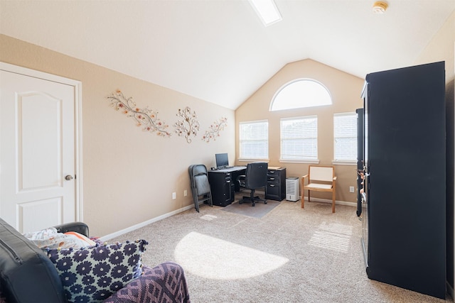 office area with light carpet and vaulted ceiling