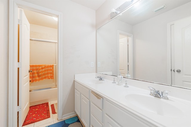 bathroom with vanity, tile patterned flooring, and shower / bath combination with glass door