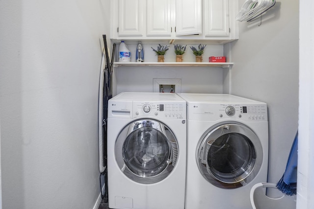 laundry area with cabinets and separate washer and dryer