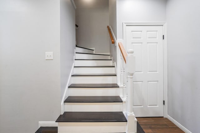 stairs with wood-type flooring