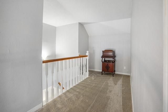 bonus room featuring vaulted ceiling and light colored carpet