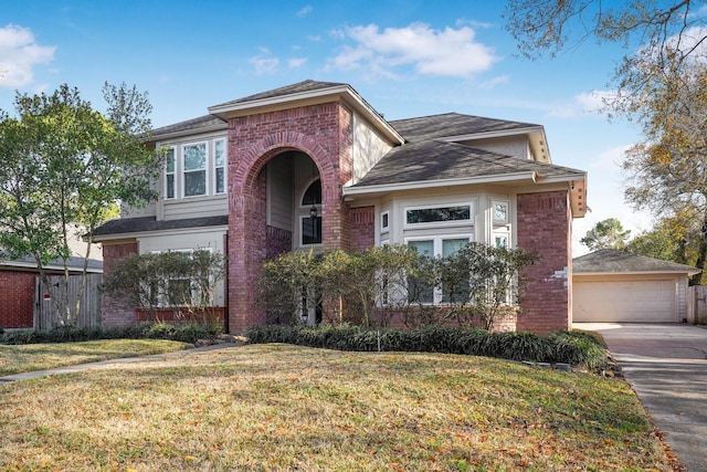 view of front of house with a garage and a front yard